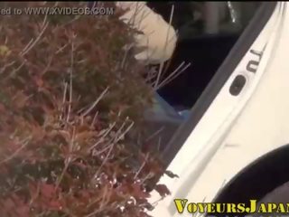 Asian street girl pees outdoors